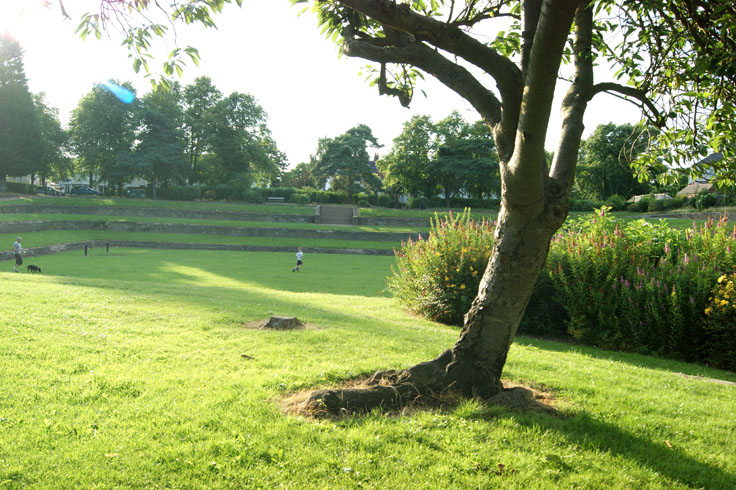 A boy and a man playing on a field.